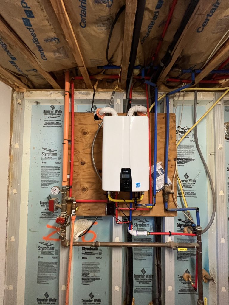 Tankless water heater installation during home construction by Marc Francis Plumbing